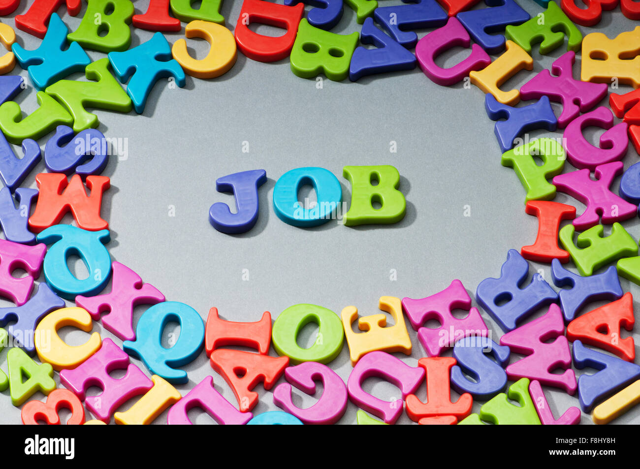 Employment concept with letters on background Stock Photo - Alamy