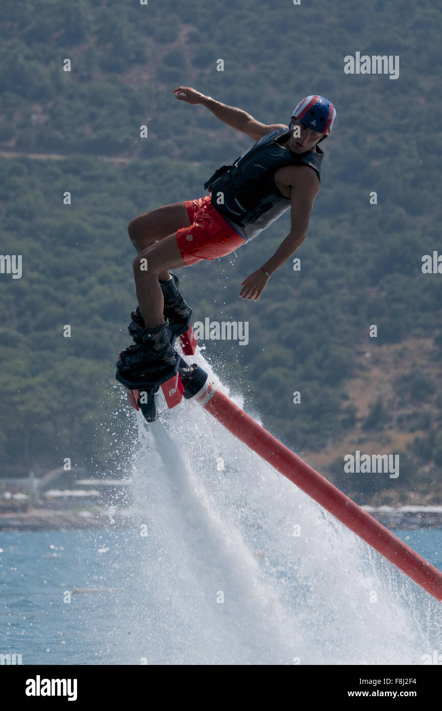 Close-up of Flyboarder in helmet looking down Stock Photo