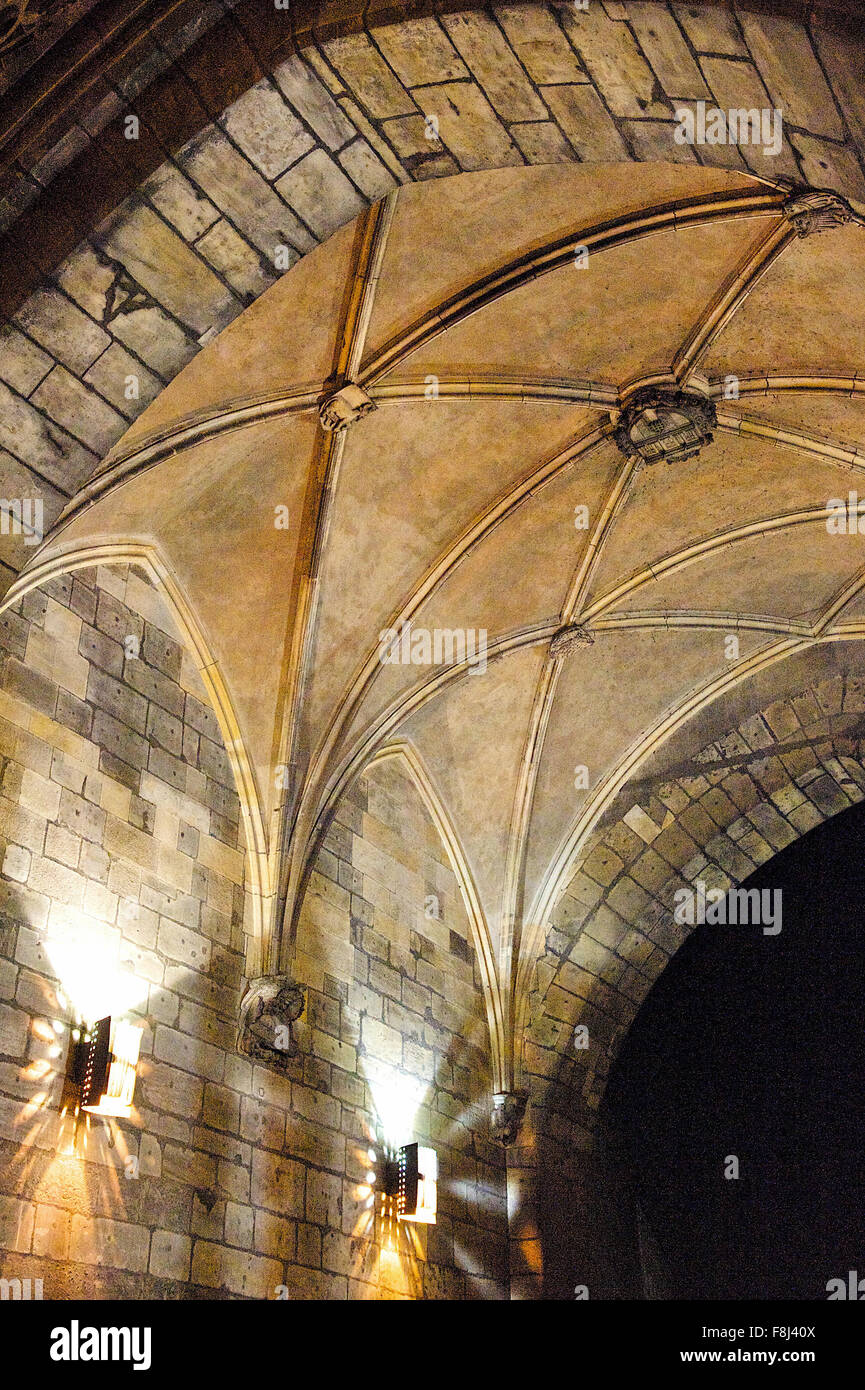 Lights inside the stunning ornate, arch leading through a passage way in Prague City, Czech Republic. Stock Photo