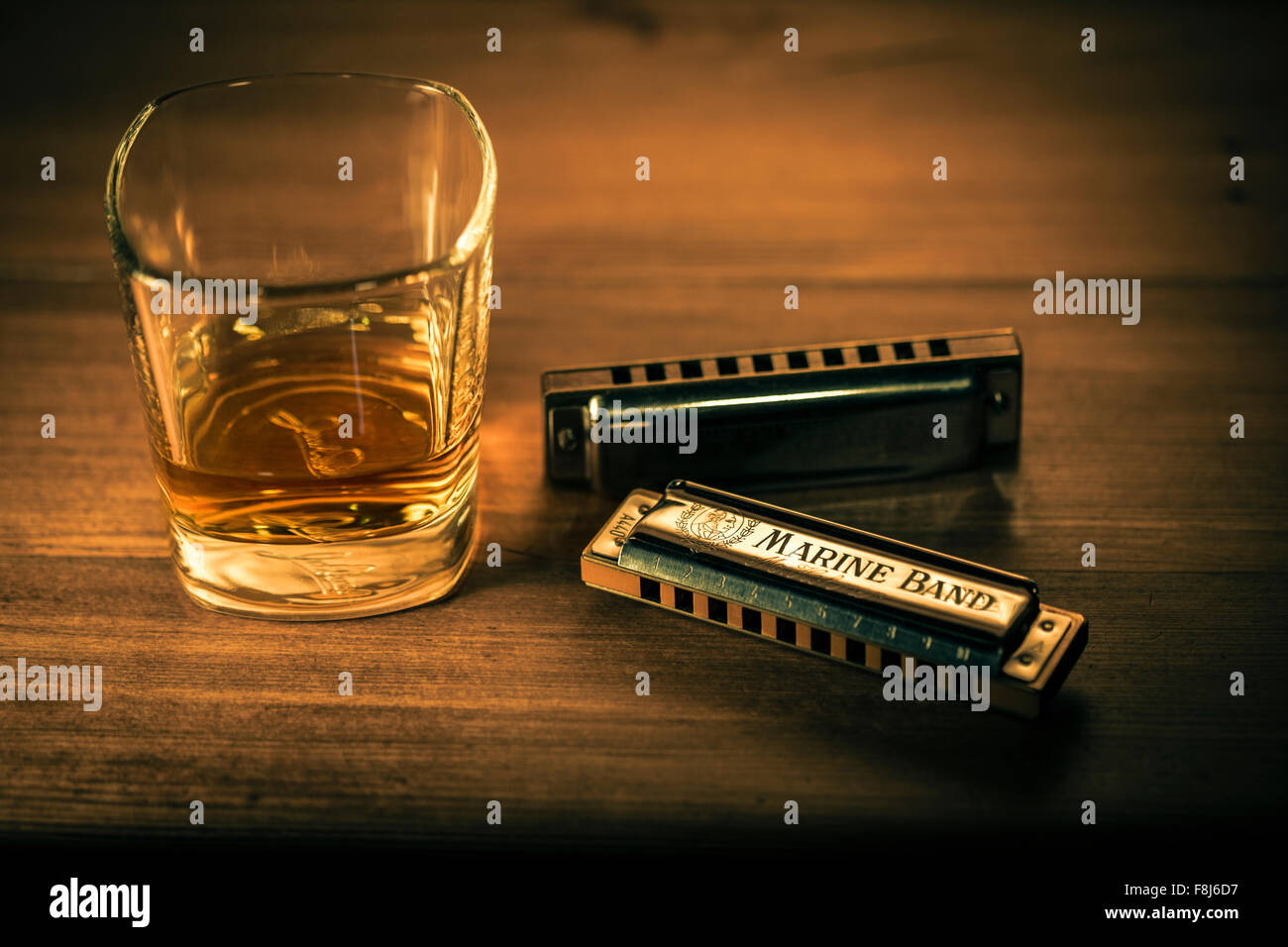 Bourbon whiskey and blues harmonicas. Stock Photo