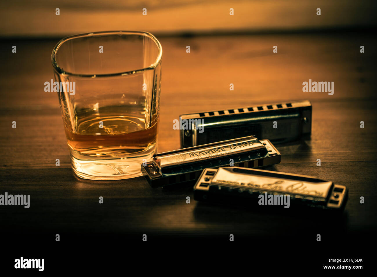 Bourbon whiskey and blues harmonicas. Stock Photo