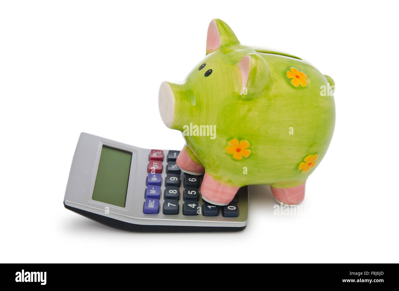 Calculator and piggy bank on white Stock Photo - Alamy