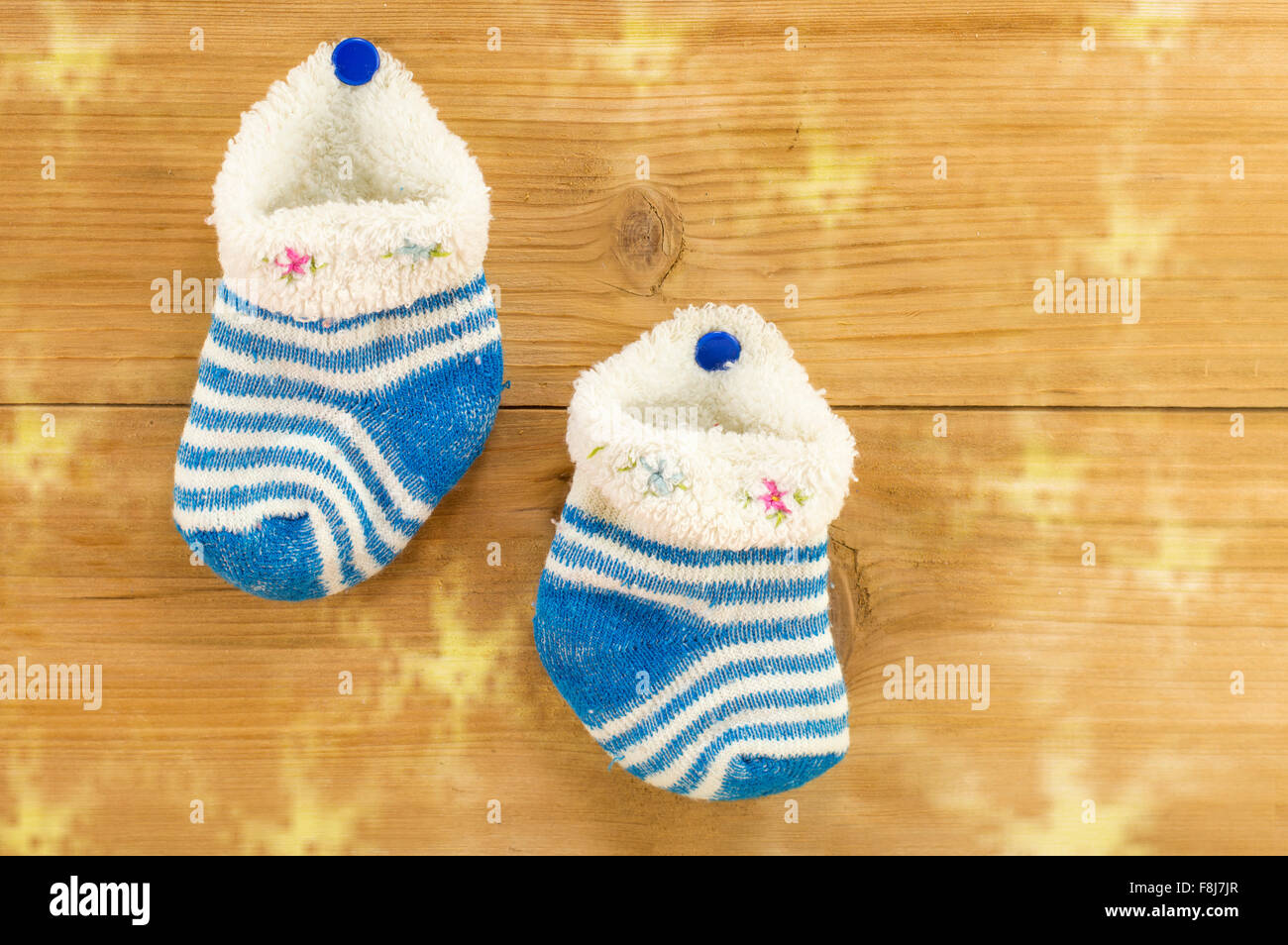 Homemade tiny wool socks hanging for the Christmas presents Stock Photo