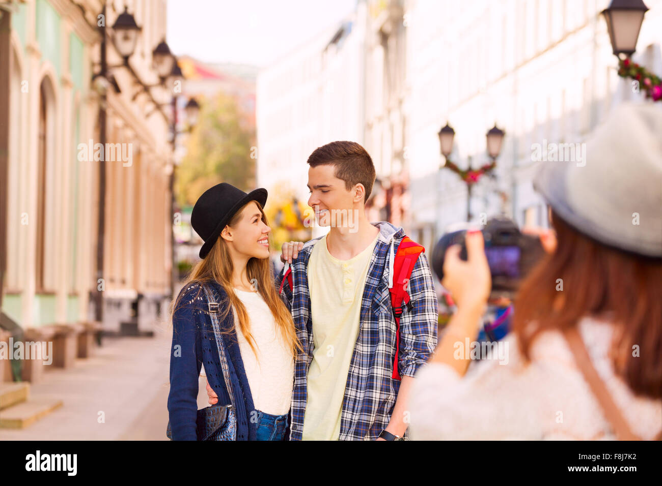 Boy with woman stand close and girl shooting them Stock Photo Alamy