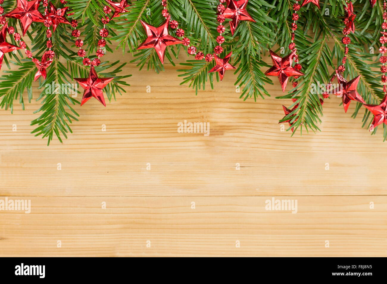 Christmas background with red ornaments and fir tree Stock Photo - Alamy