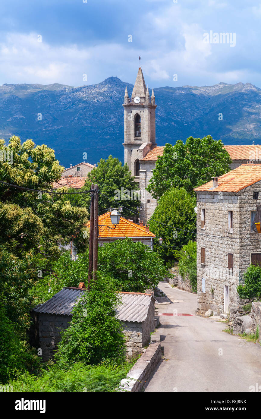 Corsican village street view, old stone houses and bell tower. Zonza, South Corsica, France Stock Photo