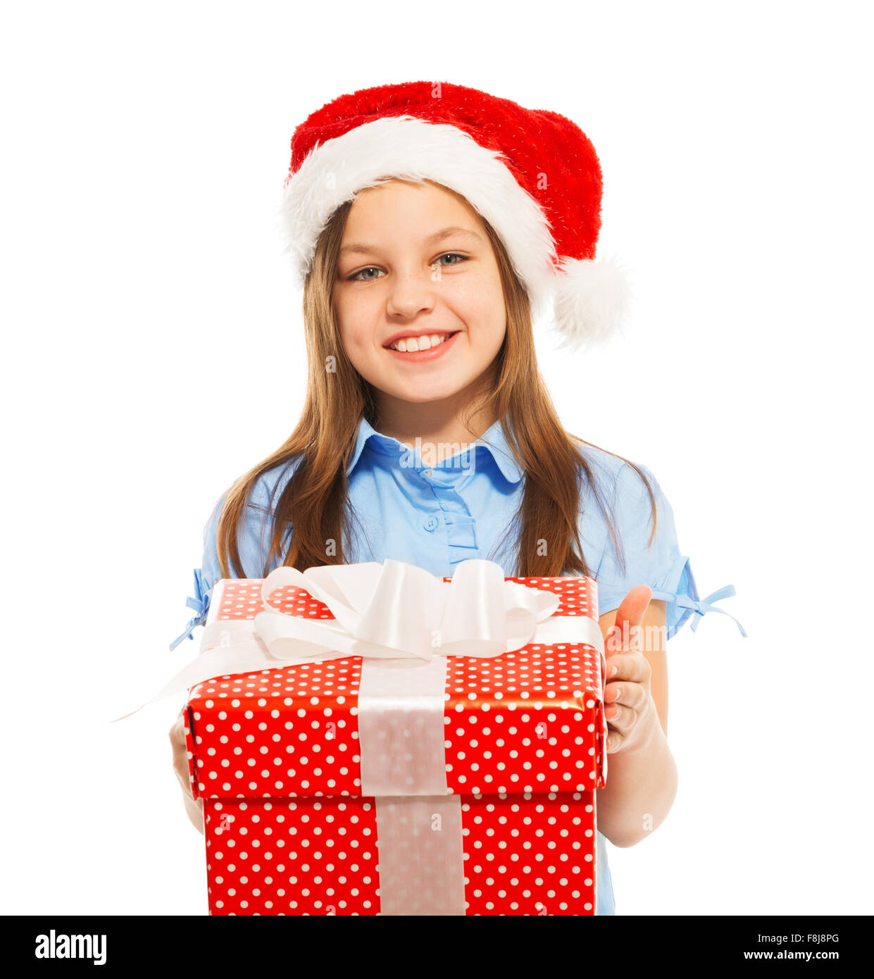 Beautiful young girl holding big Christmas present Stock Photo - Alamy