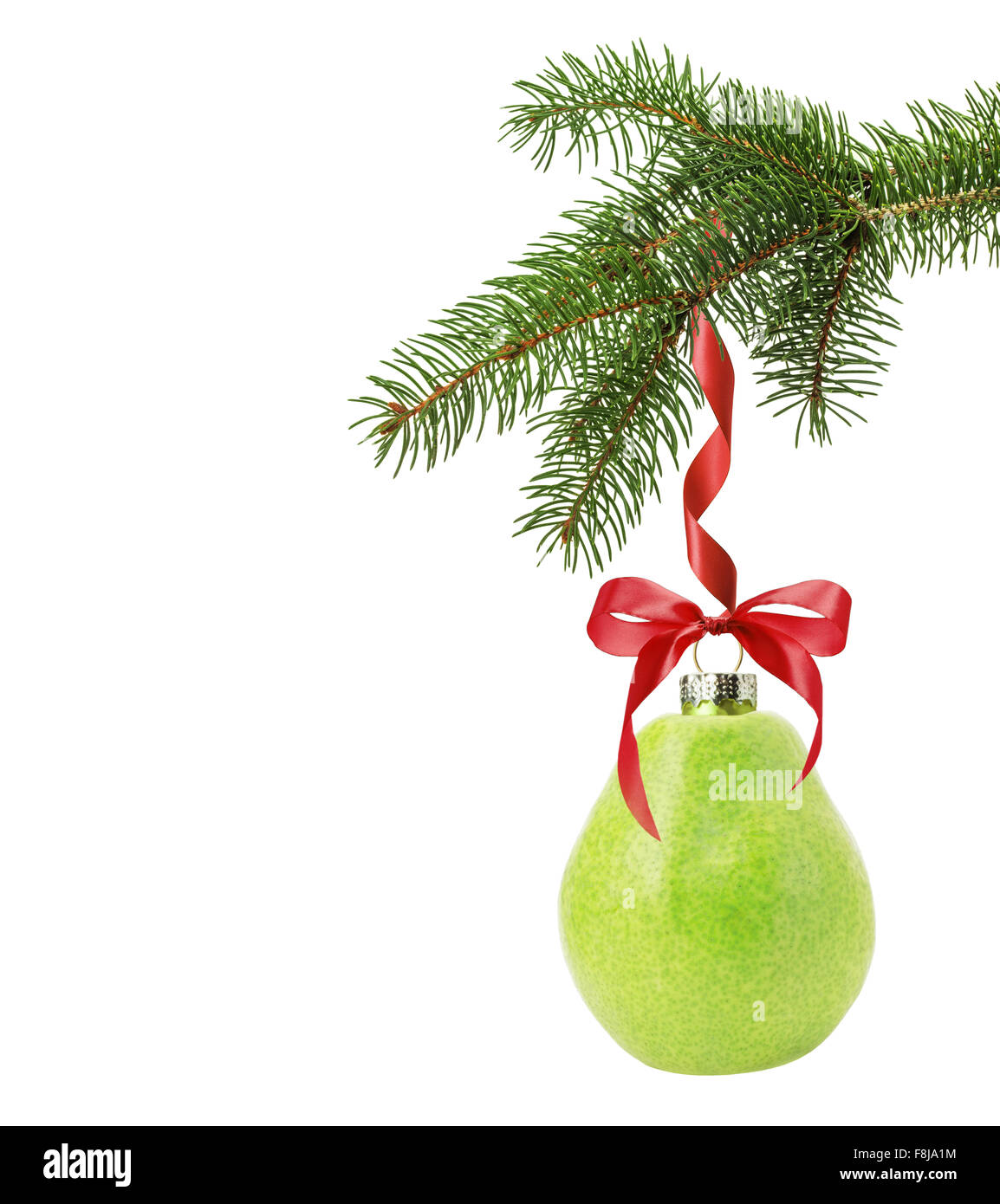 Christmas tree branch with Christmas ball in shape of pear isolated on the white background. Stock Photo