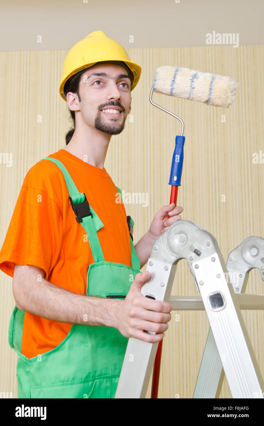 Painter worker during painting job Stock Photo Alamy