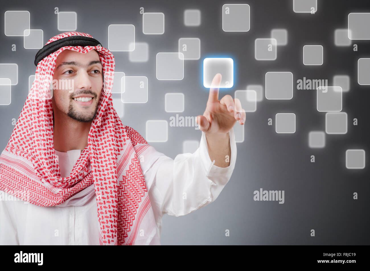 Young arab pressing virtual buttons Stock Photo - Alamy