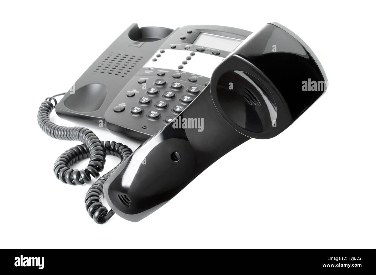 Business phone with receiver off the hook hovering in mid-air cut out isolated on a white background Stock Photo