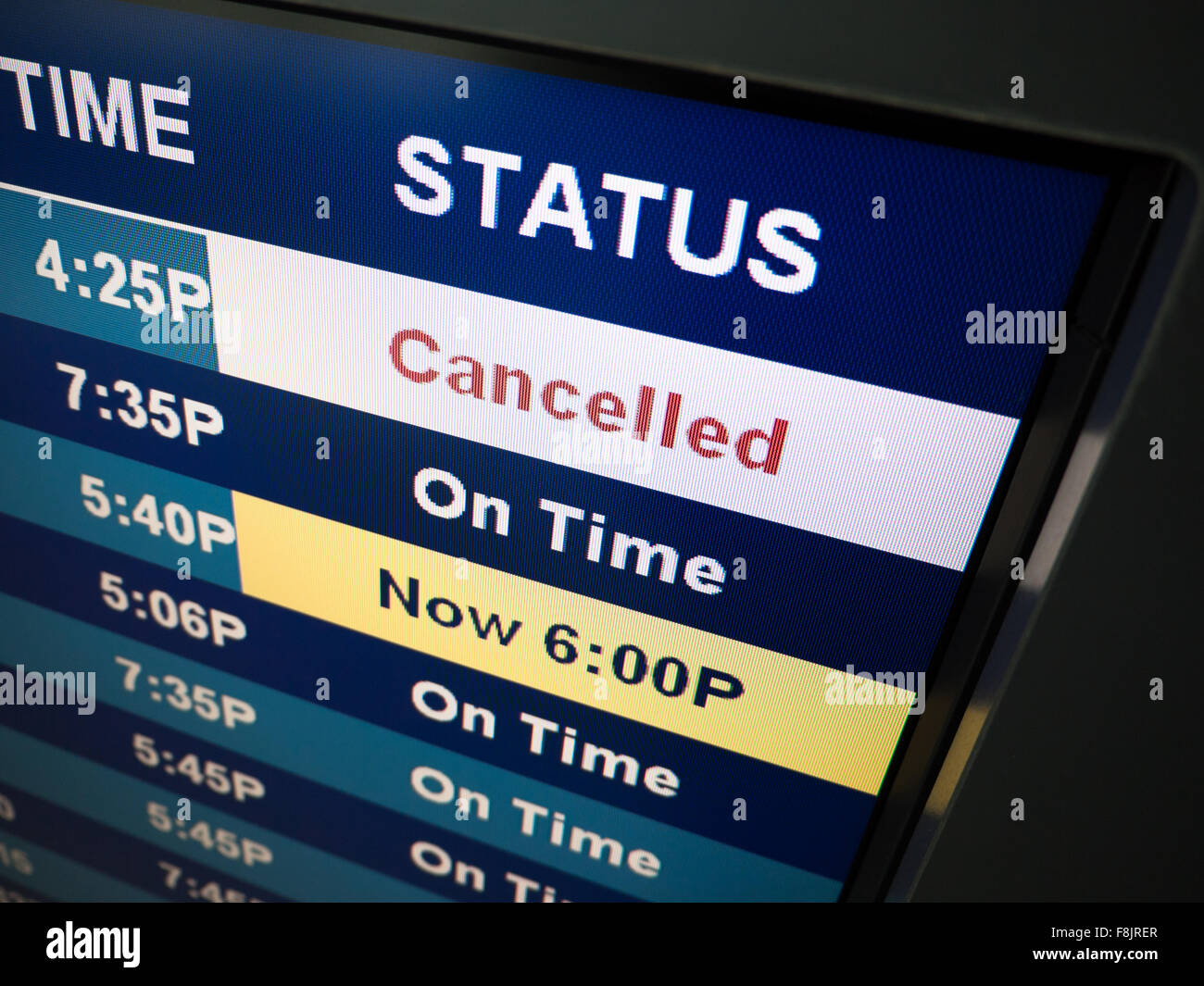 Flight cancelled. Airport arrival and departure board sign showing on-time and cancelled flight status Stock Photo