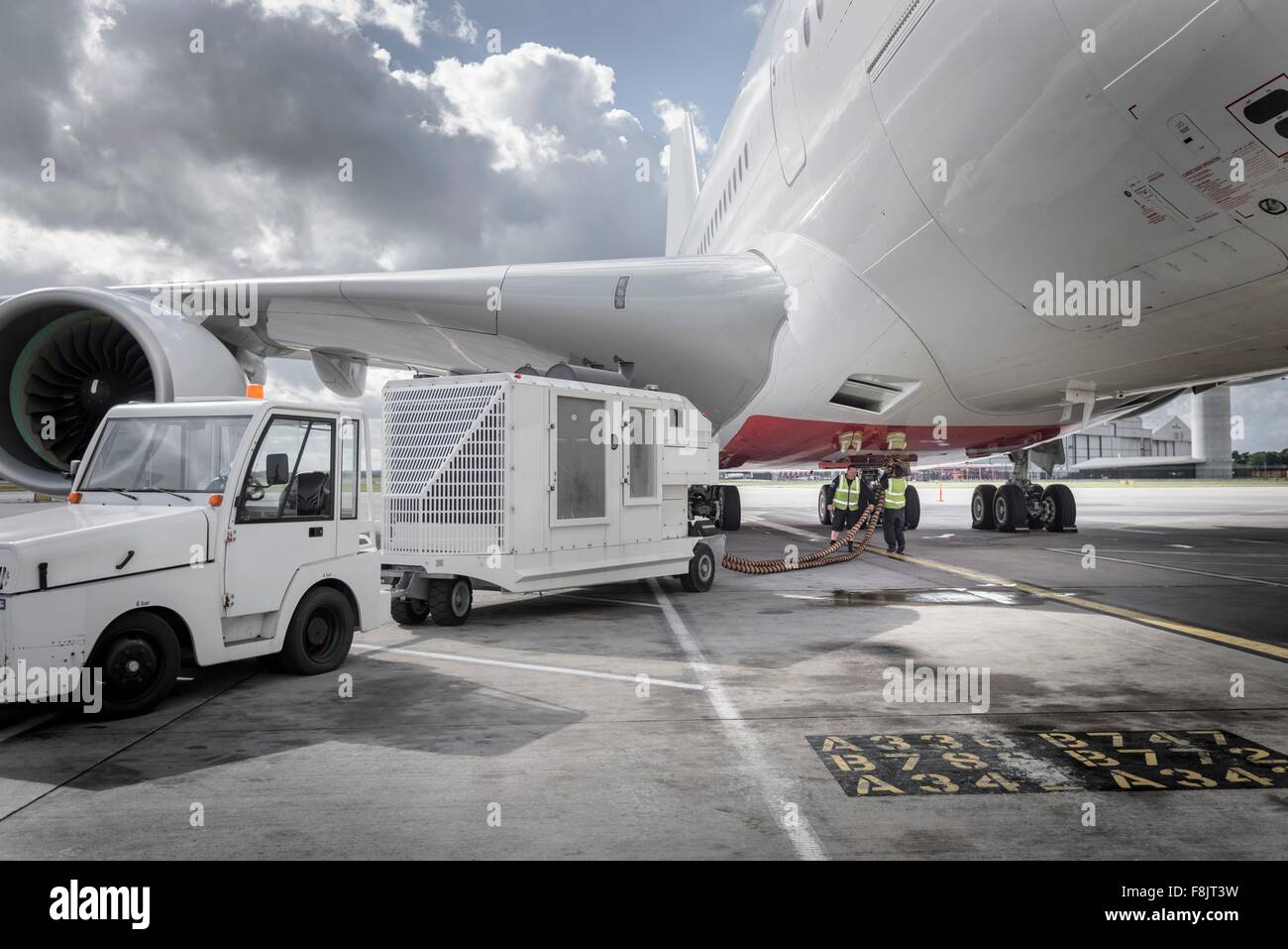 Ground crew operating loading equipment on A380 aircraft Stock Photo ...