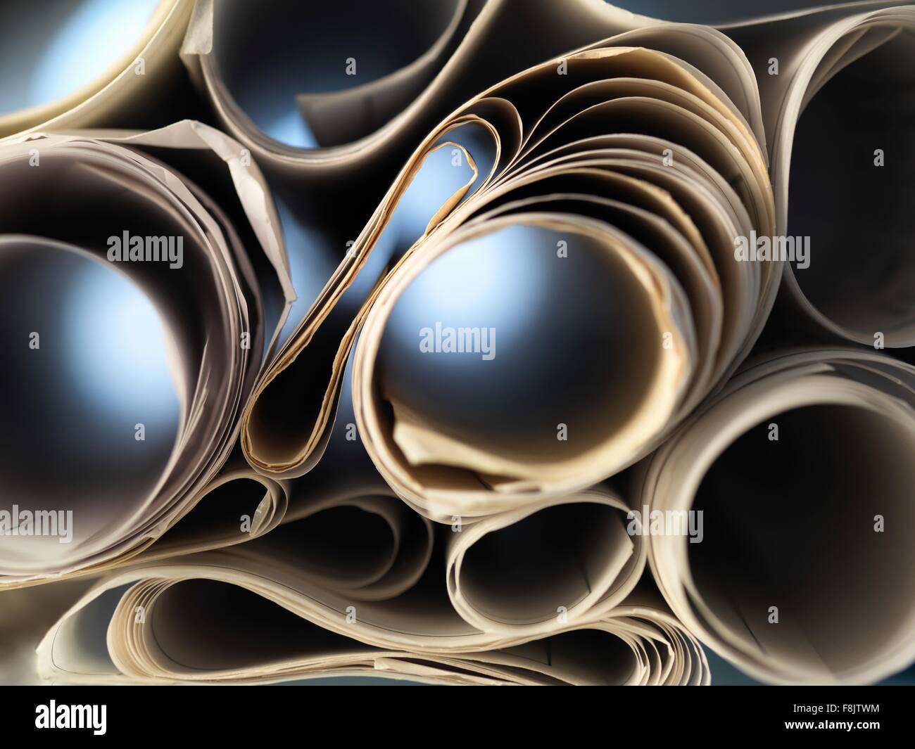 Full frame view through rolled up architectural drawings Stock Photo