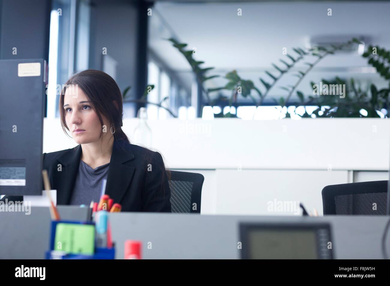 Businesswoman working on computer in office Stock Photo - Alamy