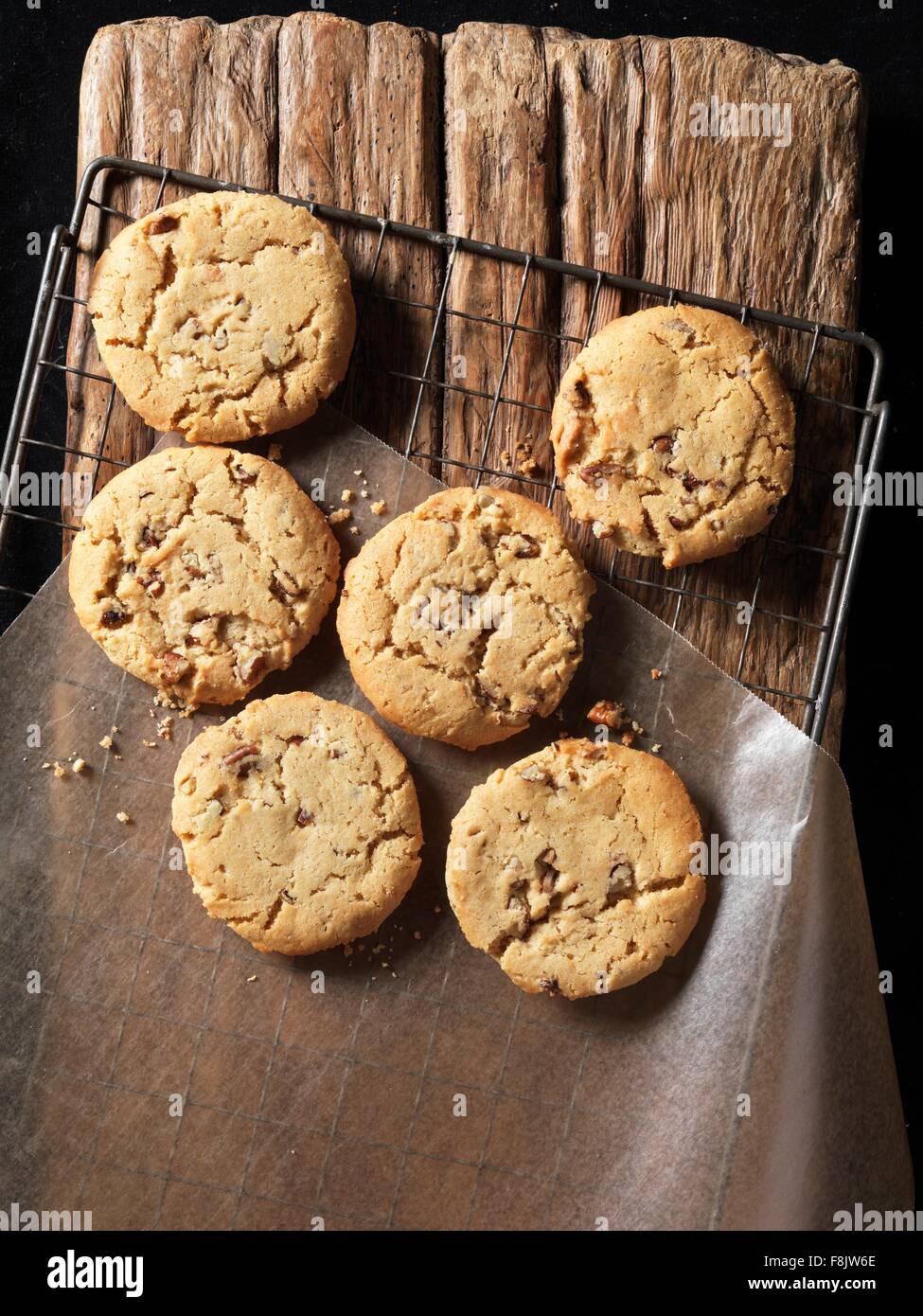 Overhead view of crunchy maple and pecan cookies on wood Stock Photo