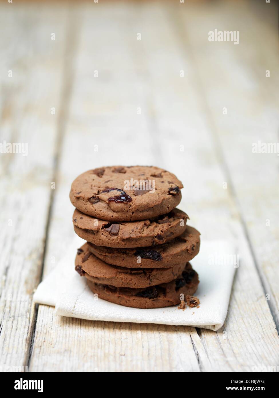 Stack of black forest cookies on tea towel Stock Photo