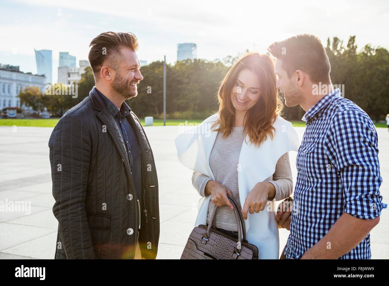 Friends meeting in town square Stock Photo Alamy