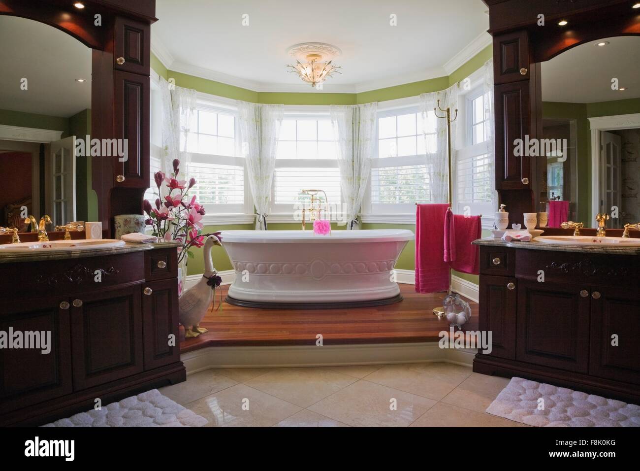 Master bedroom en suite with freestanding bathtub, cottage style home, Quebec, Canada Stock Photo