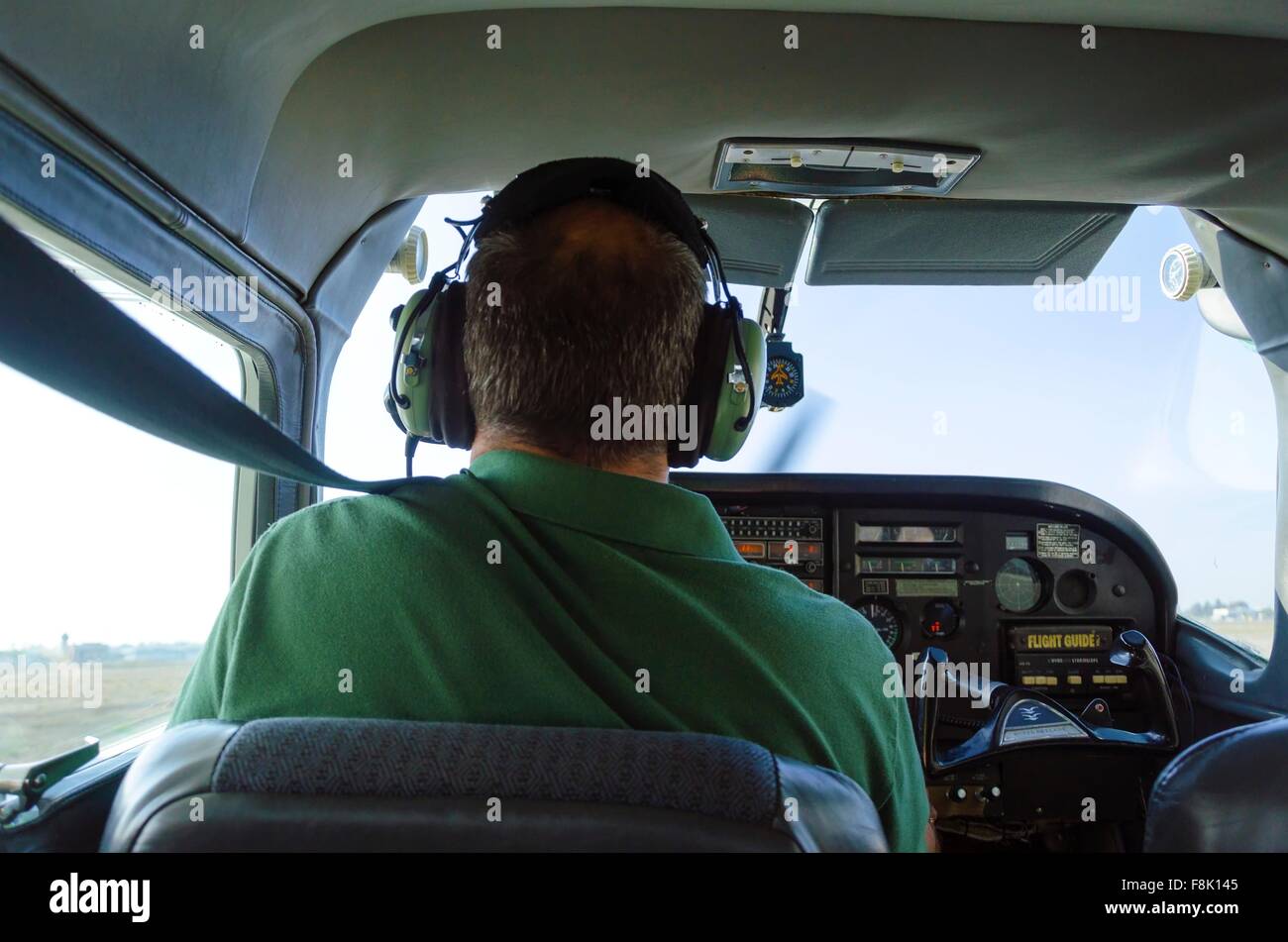 A rear view of a cessna pilot ready for landing. A small airplane with leather seats, with a passenger compartment and small con Stock Photo