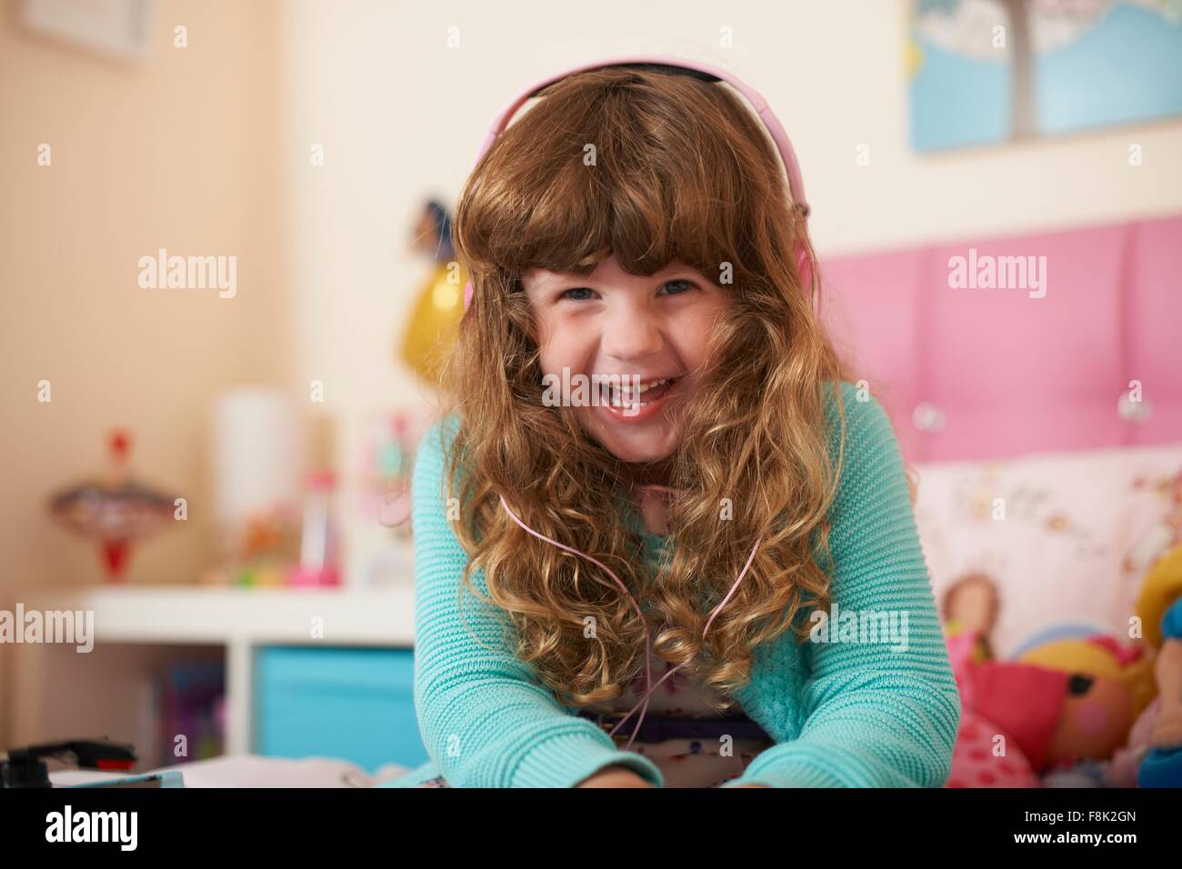 Portrait of girl in bedroom wearing headphones Stock Photo Alamy