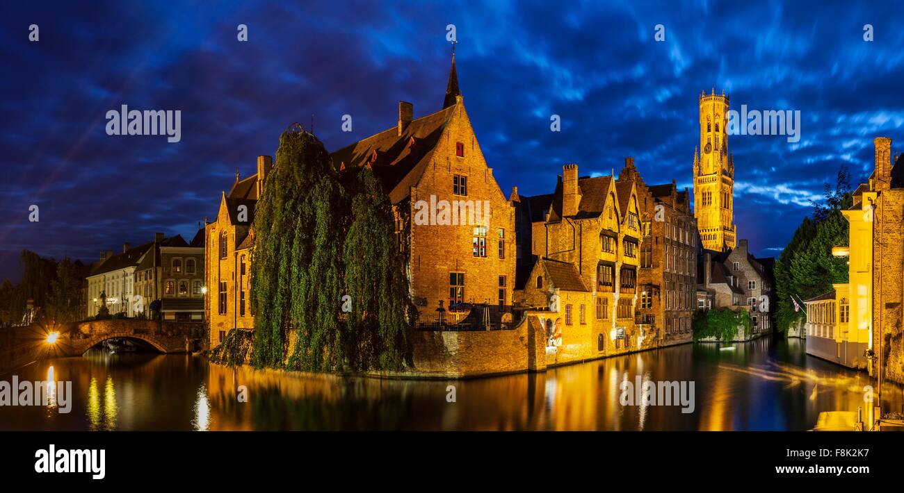 Canal waterfront and historic buildings at night, Bruges, Belgium Stock Photo