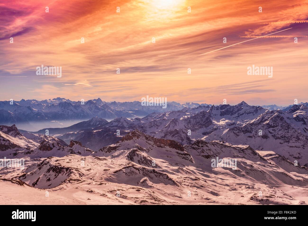 Sunset over snow covered mountains, Cervinia, Italy Stock Photo