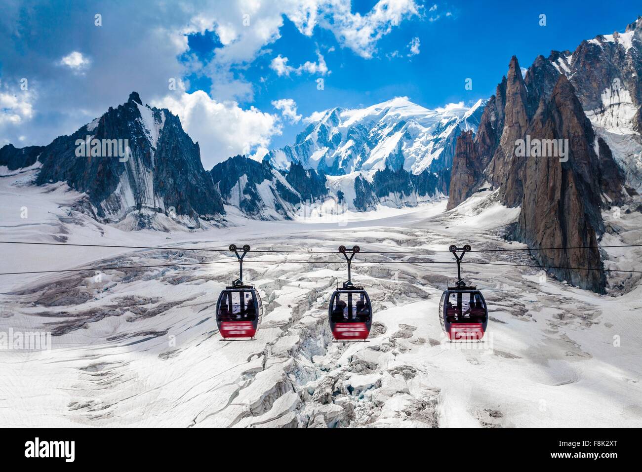 Elevated view of three cable cars over snow covered valley at Mont blanc, France Stock Photo