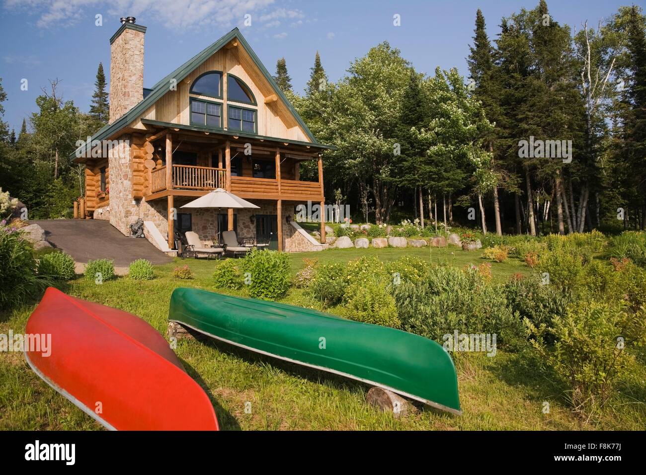Handcrafted Spruce Log Home With Fieldstone Chimney And Green