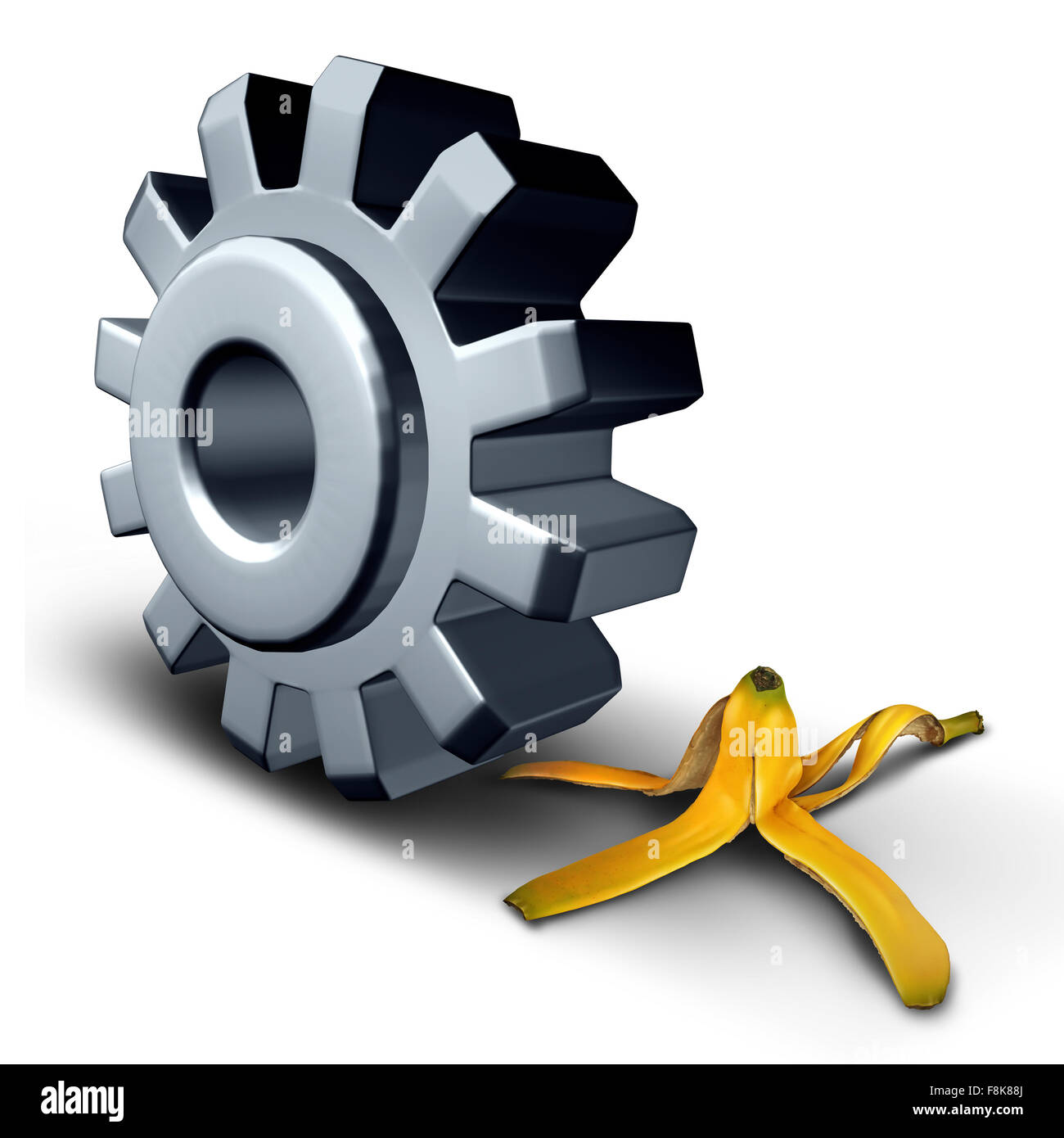 Business danger concept and risk ahead symbol or work injury and worker compensation claim due to working hazard as a gear wheel or cog rolling on to a slippery banana peel. Stock Photo