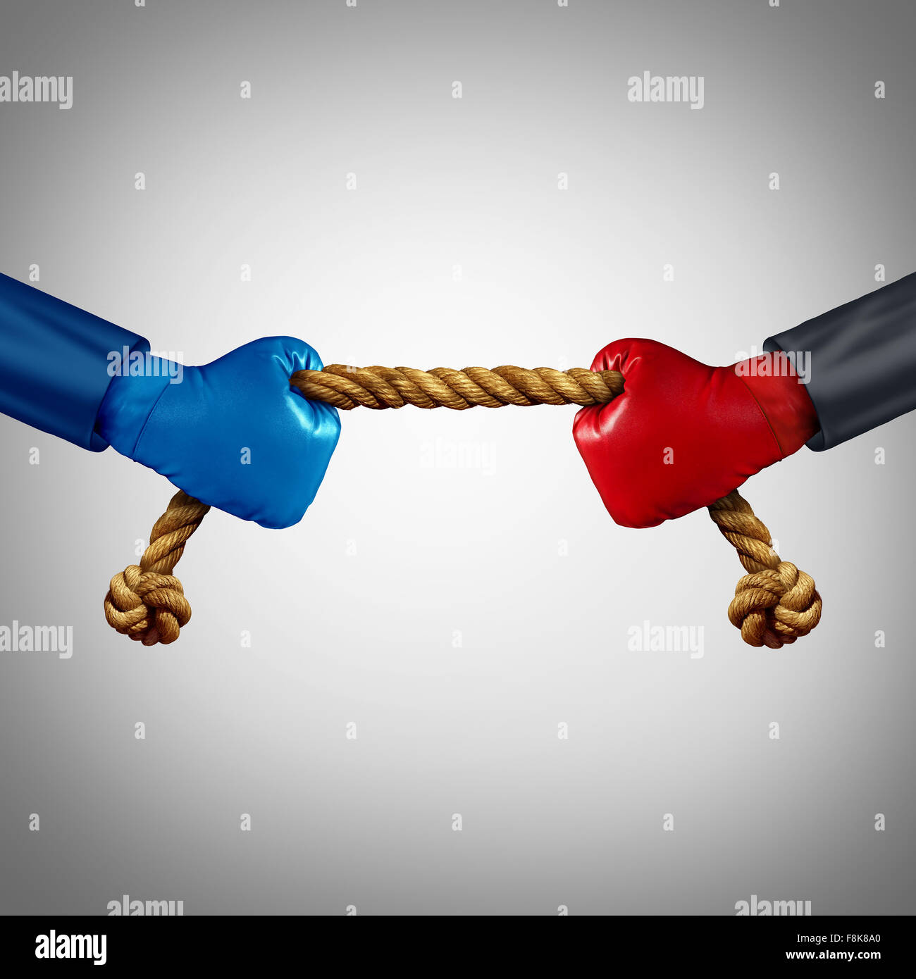 Tug of war as two opposing businessmen rivals pulling rope as a battle to win over an opponent and a test of business strength as a competition metaphor for financial strategy power between adversaries. Stock Photo