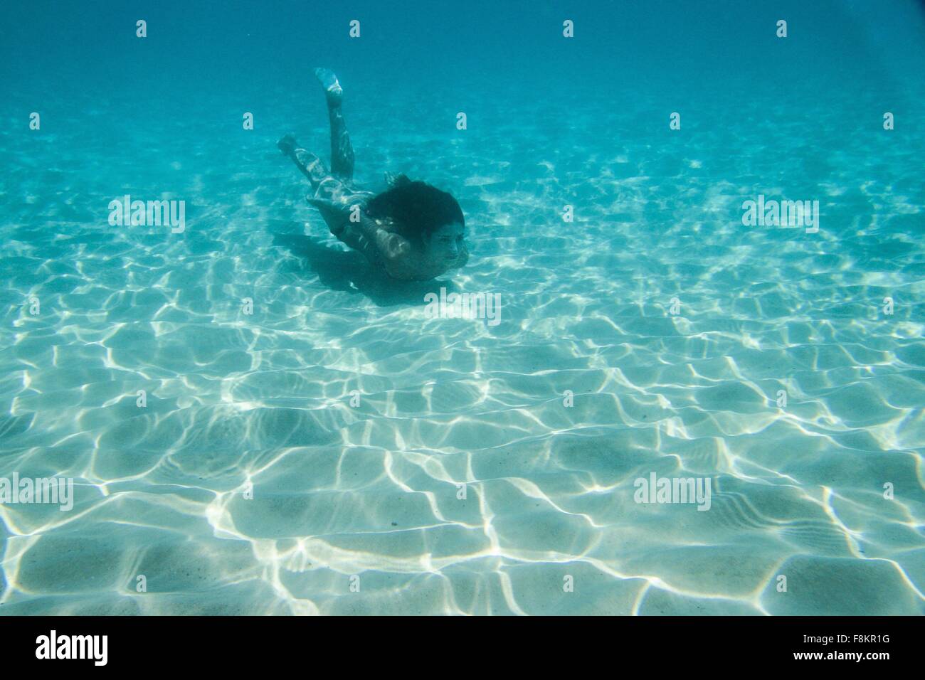 Young woman swimming underwater in ocean Stock Photo Alamy