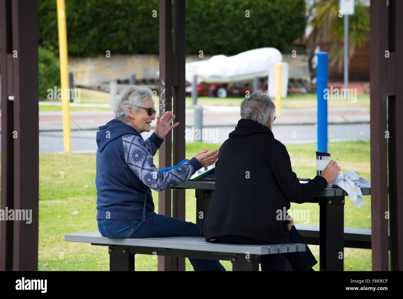 two elderly ladies chatting on a bright, sunny morning Stock Photo - Alamy