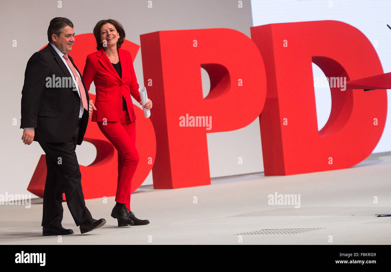 Berlin, Germany. 10th Dec, 2015. Sigmar Gabriel (L), SPD chairman and German economy minister, accompanies Malu Dreyer, premier of the German state Rhineland-Palatinate, to the speaker's podium at the national convention of Germany's Social Democratic Party (SPD) in Berlin, Germany, 10 December 2015. Around 600 delegates from across Germany will meet for three-day party convention in Berlin which will run until 12 December 2015. Photo: BERND VON JUTRCZENKA/dpa/Alamy Live News Stock Photo