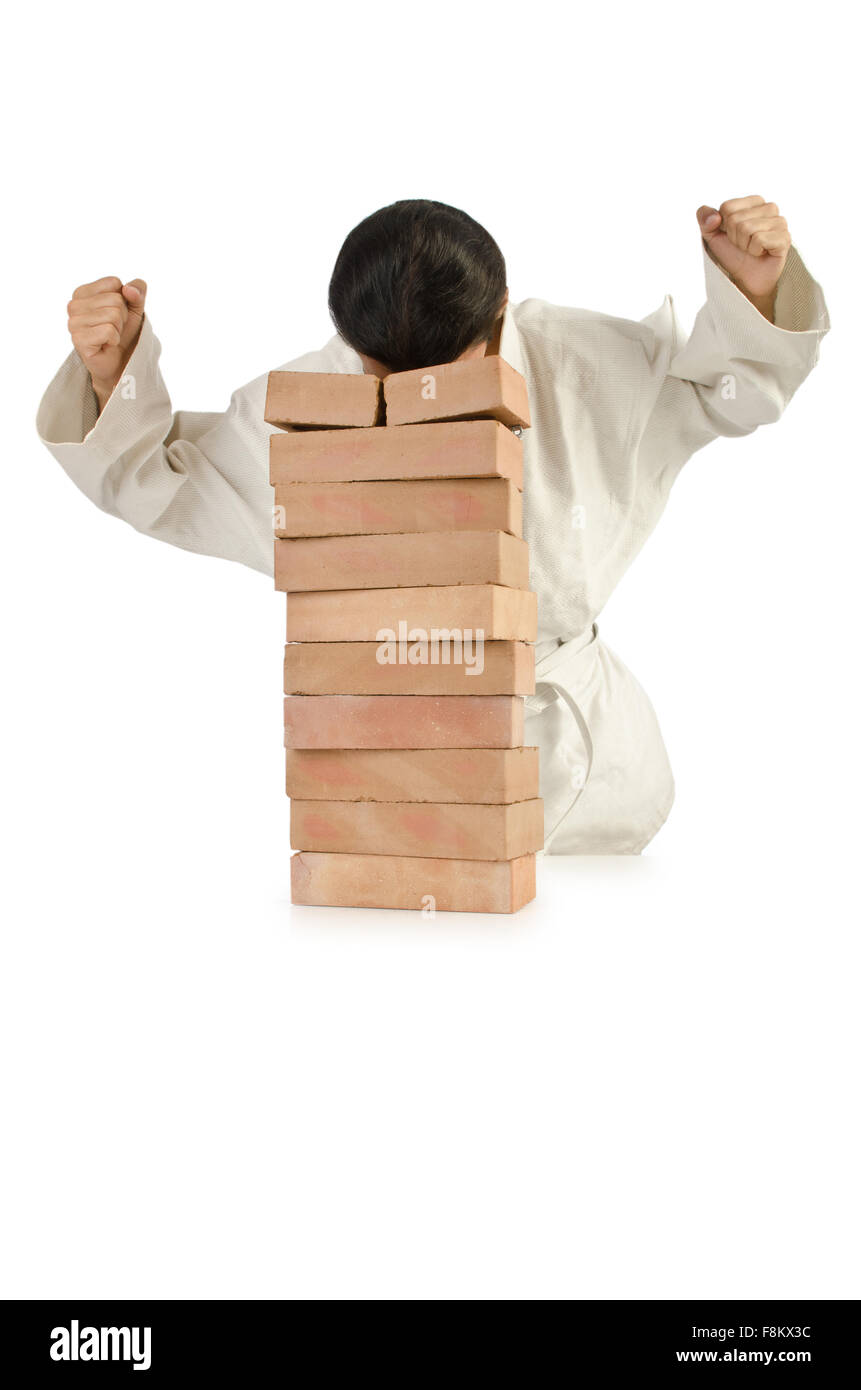 Karate man breaking bricks on white Stock Photo