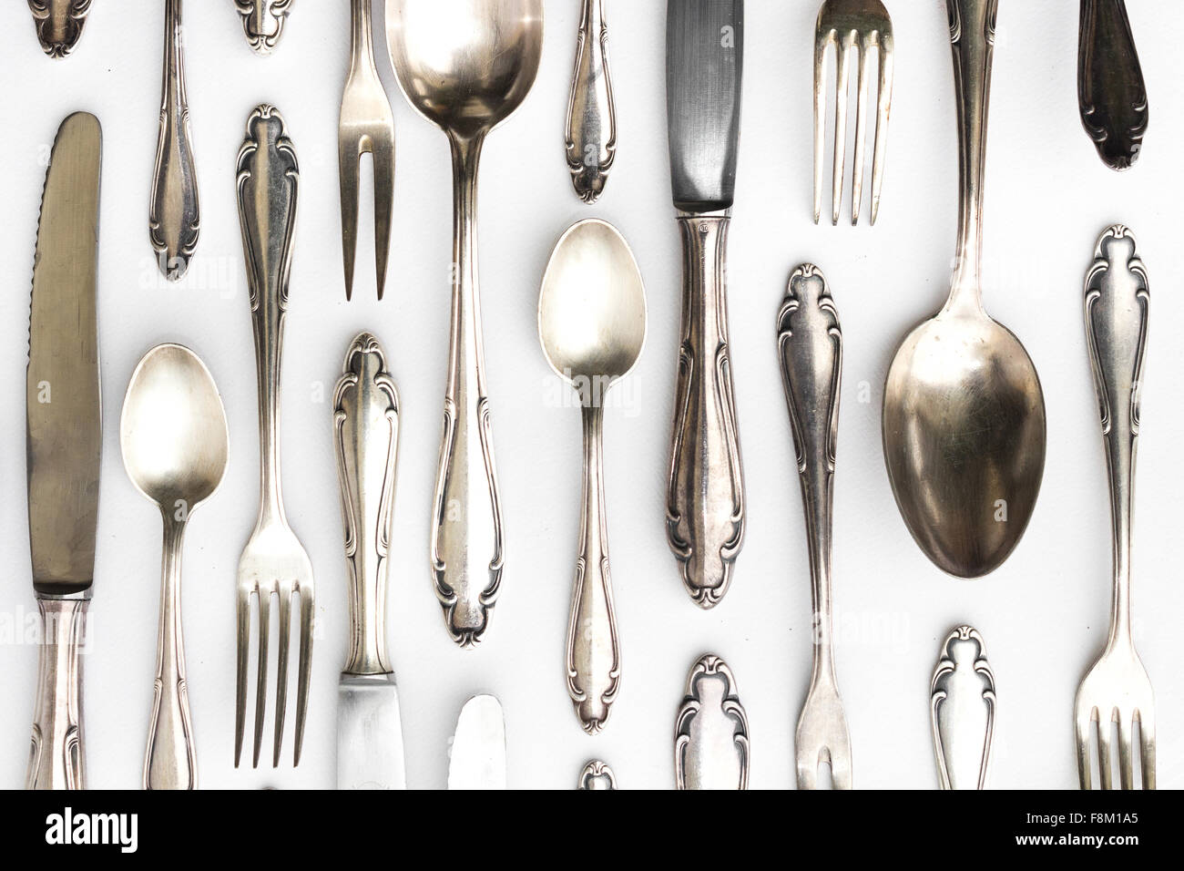 beautiful sterling cutlery collection on white background Stock Photo