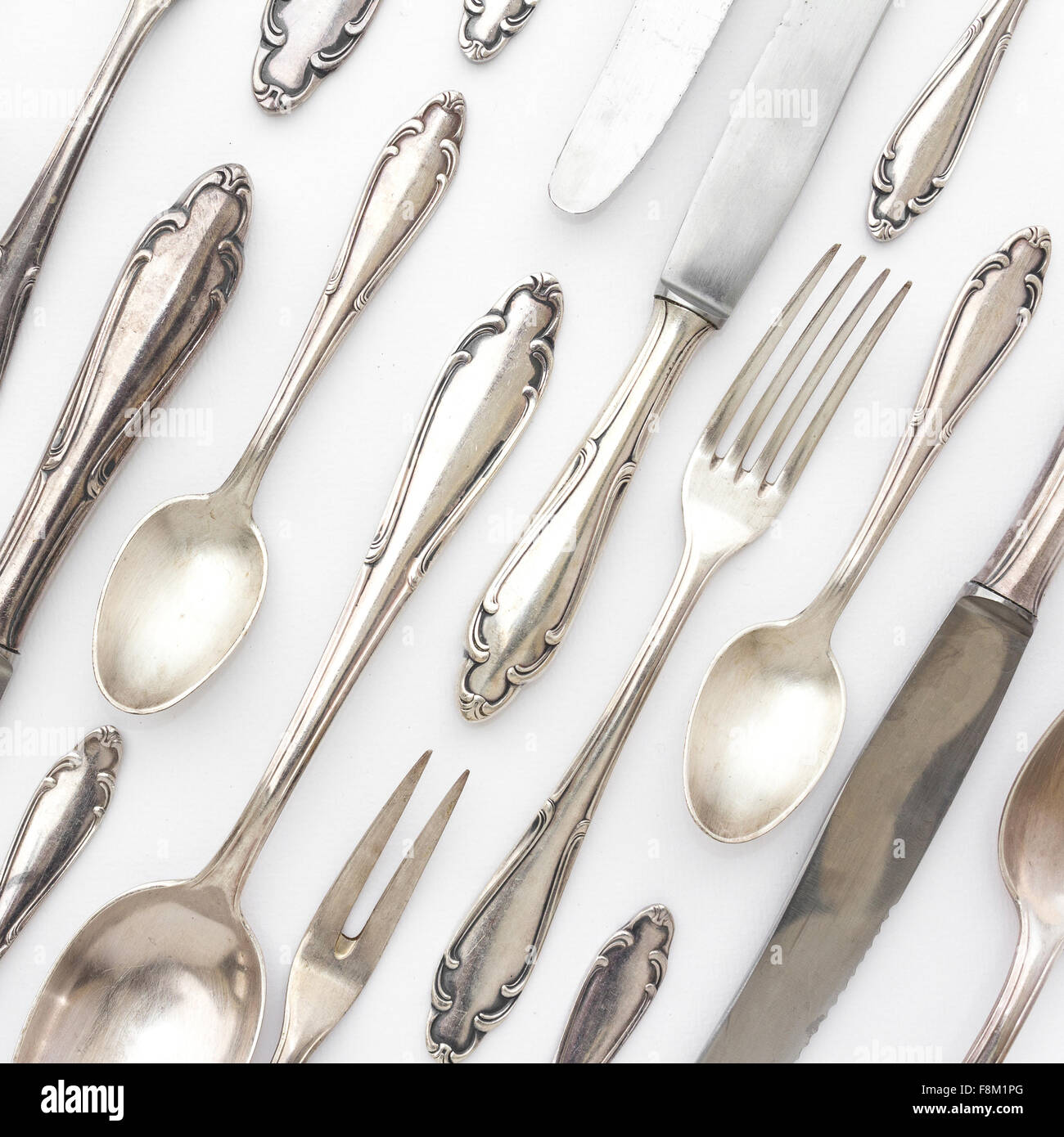 old silver cutlery collection on white background Stock Photo