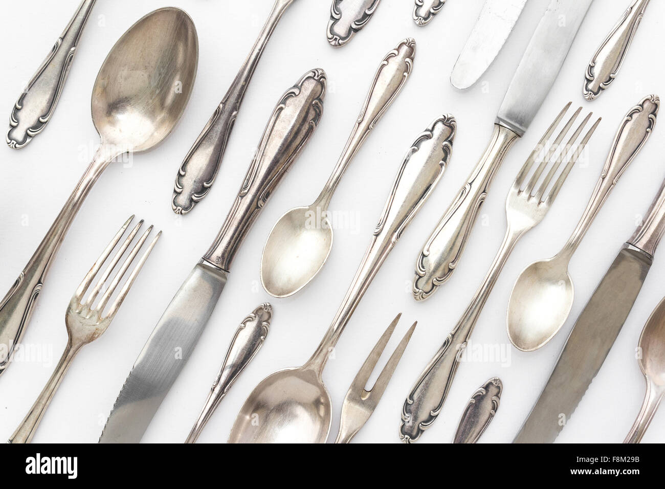 beautiful silver cutlery set arranged on white background Stock Photo