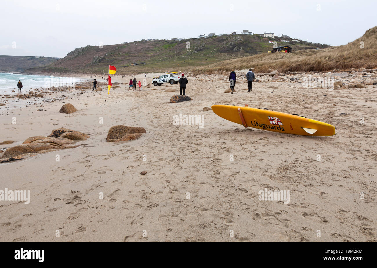 A Royal National Lifeboat Institution RNLI  rescue surf board on Sennen Cove beach Cornwall England United Kingdom Stock Photo