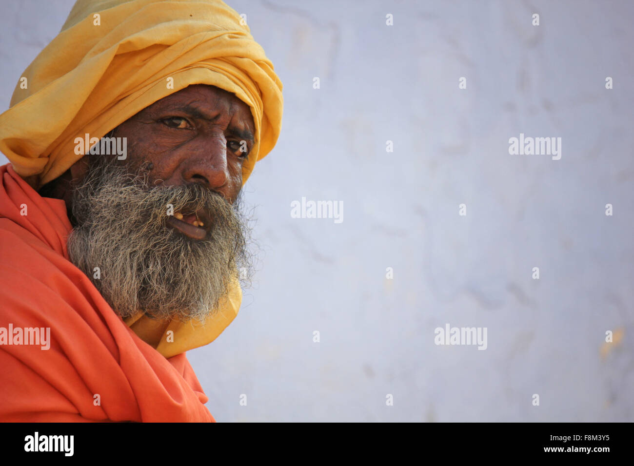 Pushkar, India, November 28, 2012: Senior Indian Man with orange turban Stock Photo