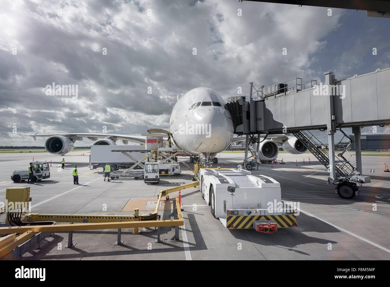 A380 aircraft and tug at stand at airport Stock Photo