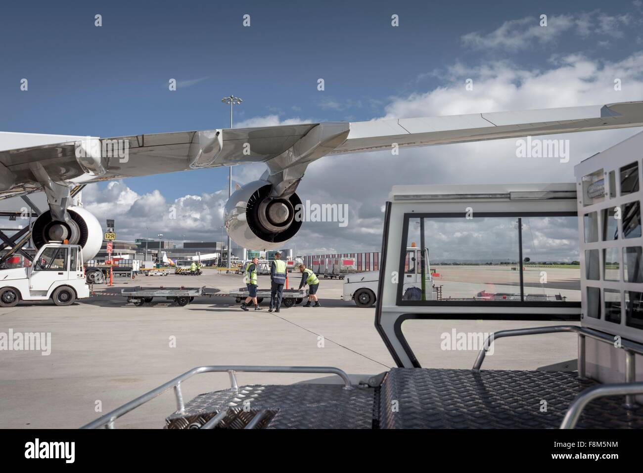 Ground crew loading A380 jet aircraft at airport Stock Photo Alamy