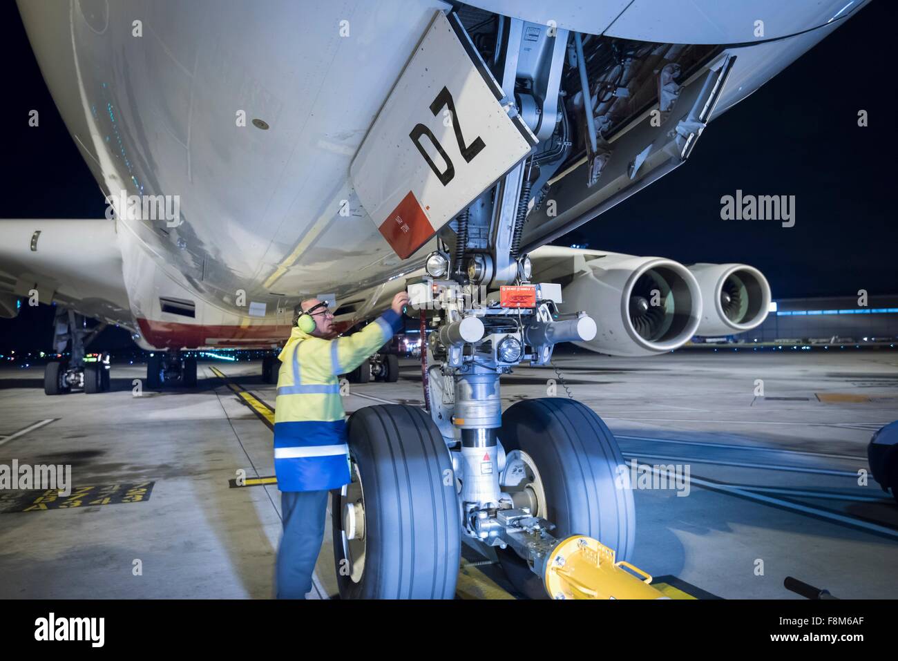Inspecting jet aircraft on runway hi-res stock photography and images ...