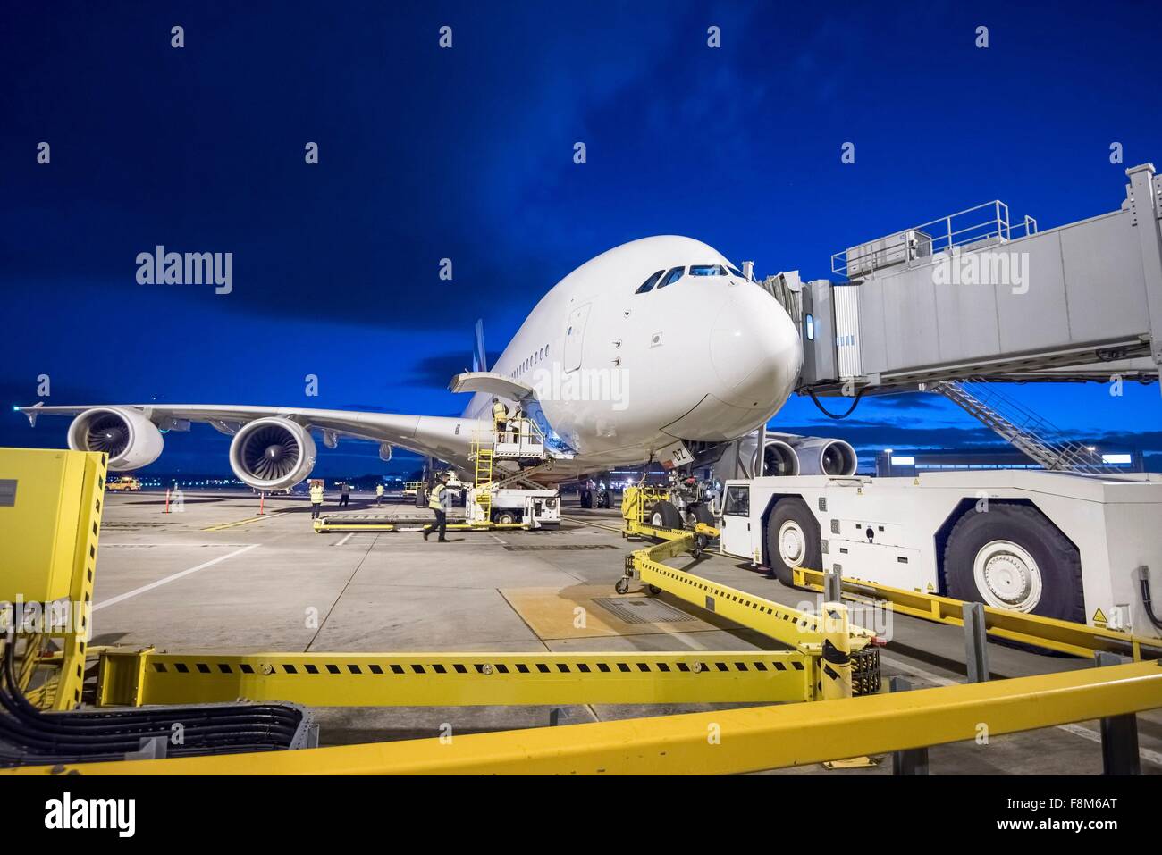 A380 aircraft on stand at airport at night Stock Photo