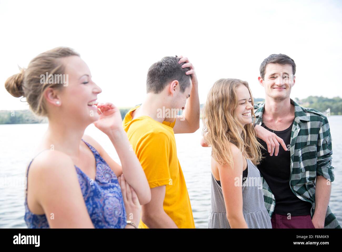 Group of young adults, outdoors, laughing Stock Photo