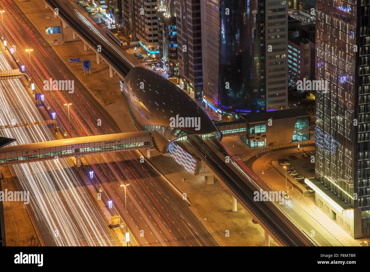 High angle view of city highway and Dubai metro rail station at night, downtown Dubai, United Arab Emirates Stock Photo