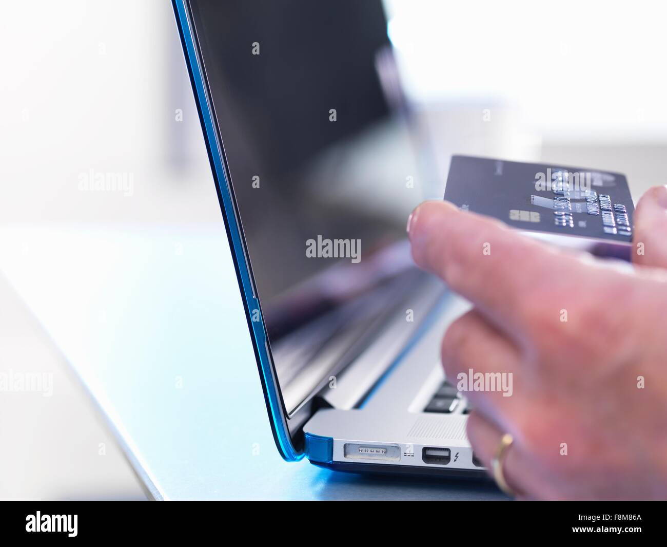 Person using credit card to buy online Stock Photo Alamy