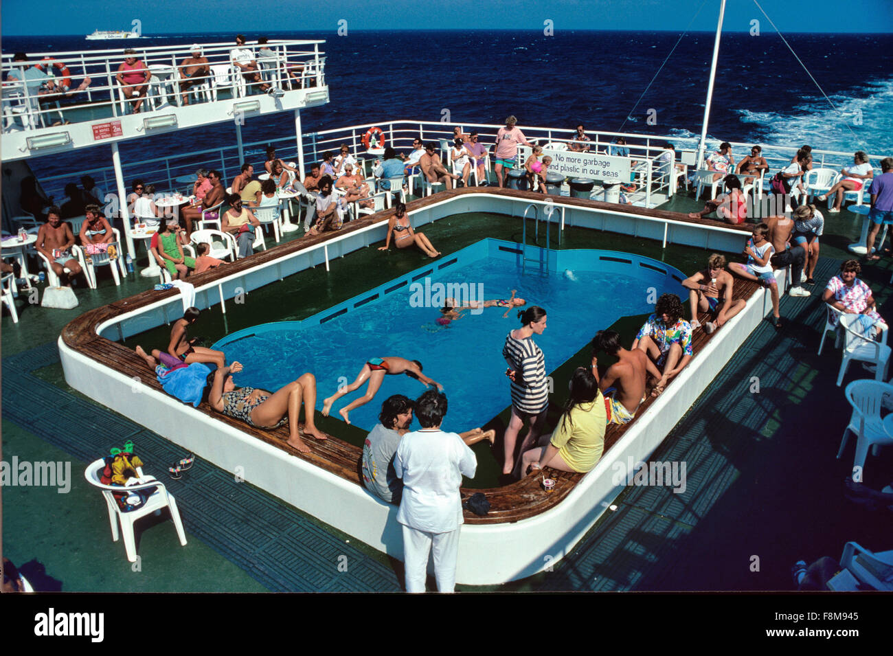 Passengers and Tourists on Board Enjoy the Swimming Pool on the Patras to Ancona Ferry Boat between Greece and Italy Stock Photo