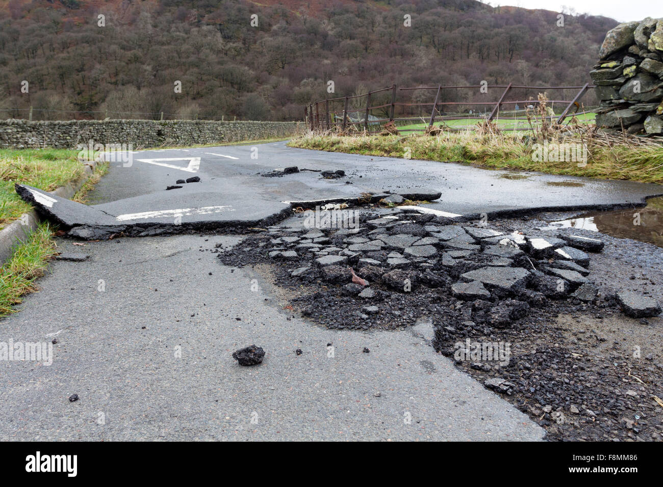 Hartsop, Cumbria, 10th December 2015. UK Weather.  Heavy overnight rain has led to further flooding in Cumbria, particularly around Glenridding.  Close to the nearby village of Hartsop evidence of the power of the floodwater from Storm Desmond could also be seen where it had damaged the road, an electric substation and the surrounding farmland. Credit:  David Forster/Alamy Live News Stock Photo