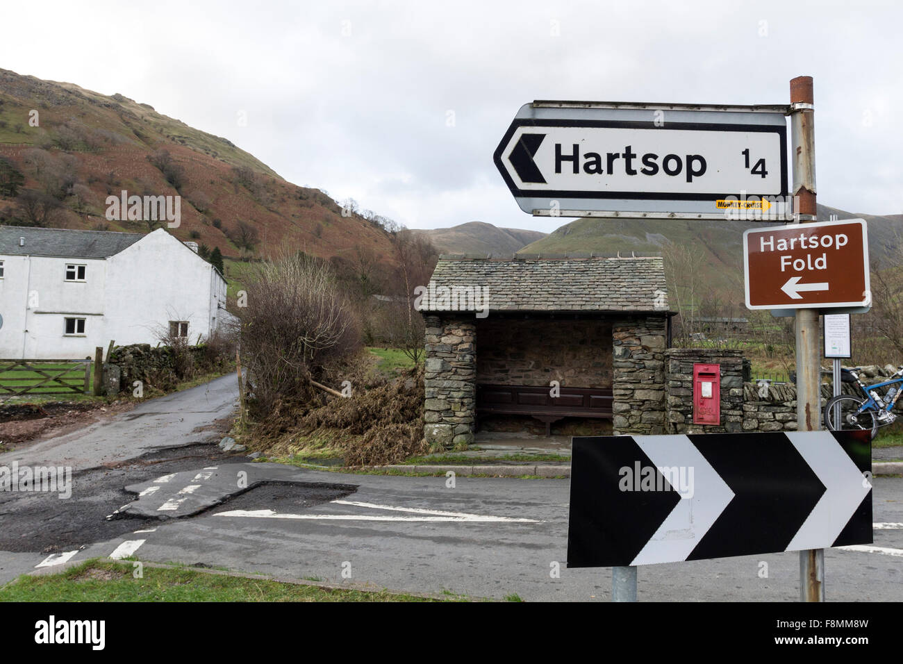 Hartsop, Cumbria, 10th December 2015. UK Weather.  Heavy overnight rain has led to further flooding in Cumbria, particularly around Glenridding.  Close to the nearby village of Hartsop evidence of the power of the floodwater from Storm Desmond could also be seen where it had damaged the road, an electric substation and the surrounding farmland. Credit:  David Forster/Alamy Live News Stock Photo